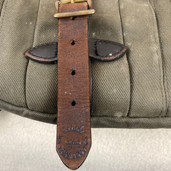 Left strap view on Filson Otter Green Rugged Twill Rucksack